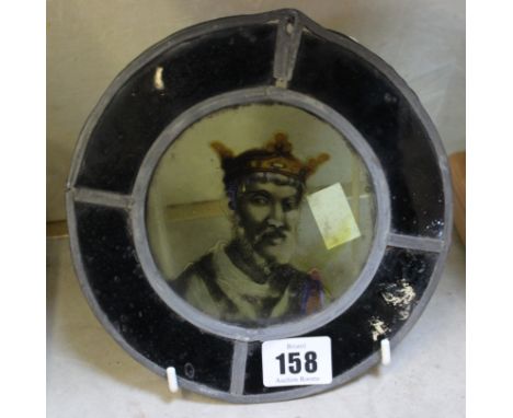 A stained glass roundel, the centre enamelled with a royal portrait, probably 18th Century, 17cm in diameter 