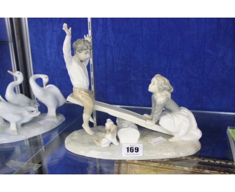 A Lladro group of two children on a seesaw, Lladro geese, a Nao figure, a Royal Copenhagen figure of a mermaid and another fi