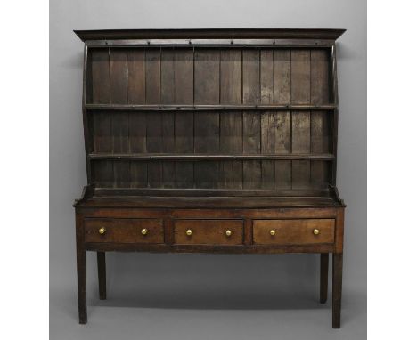 A 17TH CENTURY OAK DRESSER, the two-shelf plate rack of unusual shaped form above a base with three drawers on square section