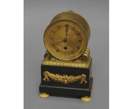 A FRENCH EMPIRE STYLE GILT AND BLACK SLATE MANTEL TIMEPIECE, early-mid 19th century, the 3 1/2" gilt engine-turned dial on a 