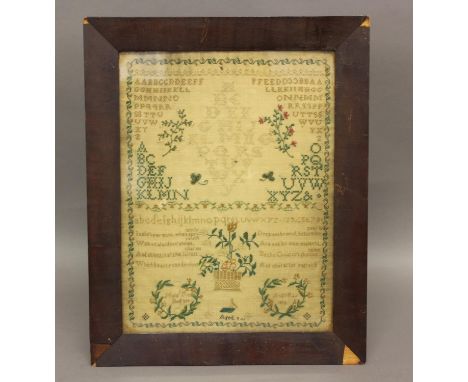 A GEORGE III SAMPLER, by Margaret Rea, Belfast, dated 1814 and worked with the alphabet, religious text and floral sprays and