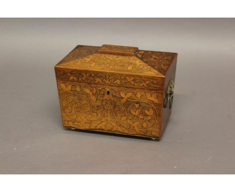 A REGENCY INLAID TEA CADDY, of sarcophagus form, the interior with twin lidded canisters, with scrolling floral marquetry inl