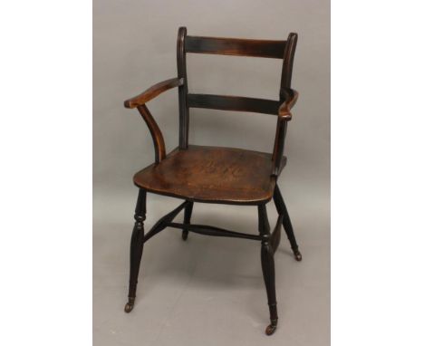 A 19TH CENTURY ELM ARMCHAIR, with ladder back, outswept arms and turned supports, castors added, height 87cm