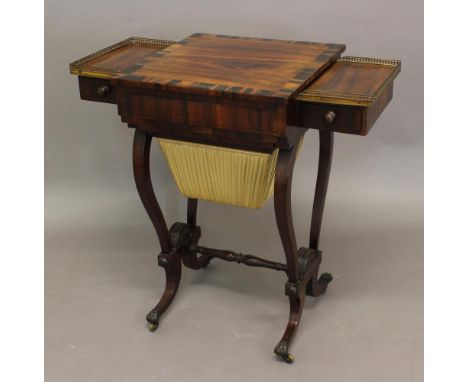 A REGENCY ROSEWOOD GAMES TABLE, the easel-top enclosing a backgammon board, flanked by galleried drawers with a work or games