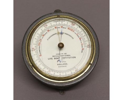 A FISHERMANS ANEROID BAROMETER, by Dollond, London, No.2756, issed by the Royal National Life Boat Institution, in a metal ca
