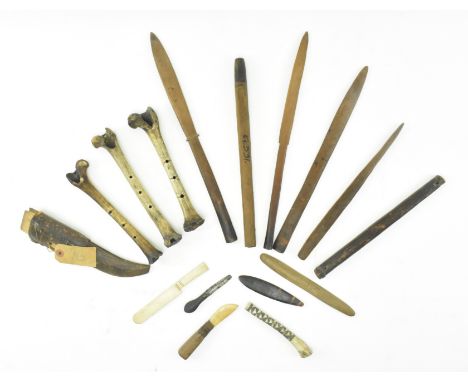 A collection of approximately fifteen tribal African and New Guinea carved wood &amp; bone weaponry &amp; tools. The lot to i
