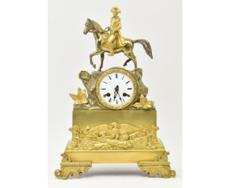 A 19th century French Empire style mantle clock. The clock featuring&nbsp; brass figural scene of Napoleon atop his horse ato