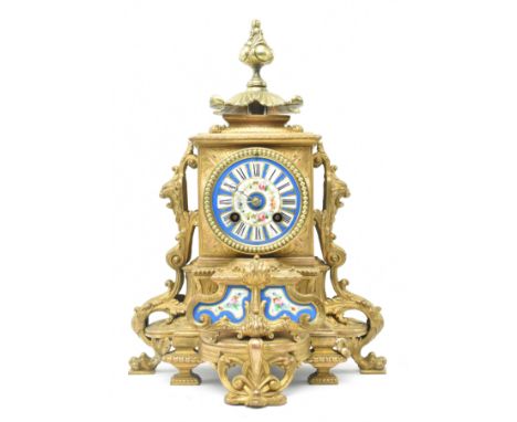 A French late 19th - early 20th century gilt metal two train mantel clock. The mantle clock featuring gilt metal foliate fini