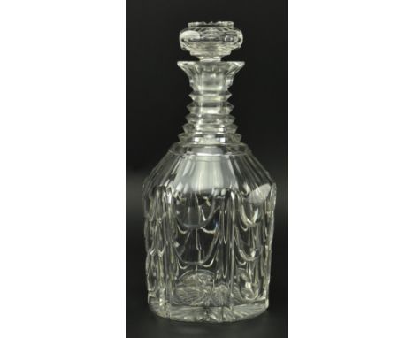 An early 19th century heavy step cut glass decanter. The decanter with hollow mushroom shaped stopper, ridged sunburst design