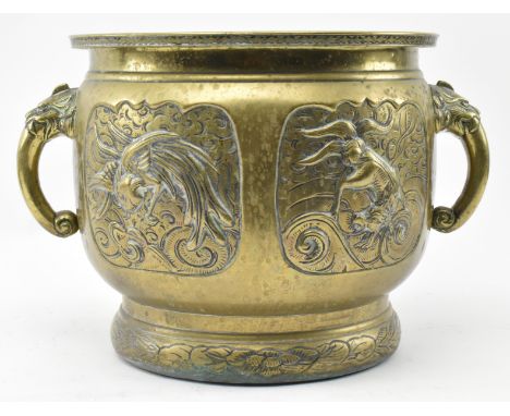 A Japanese Meiji period late 19th / early 20th century polished bronze mythological planter / handled pot. The planter having