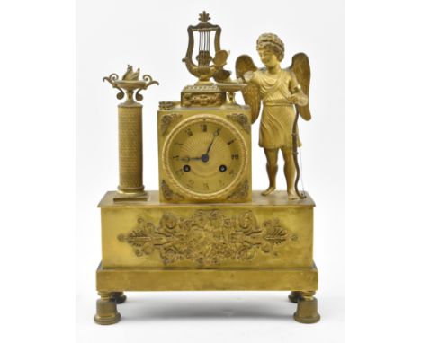 A French Neo Classical 19th century eight day movement brass mantle clock. The mantel clock featuring central raised lyre ove