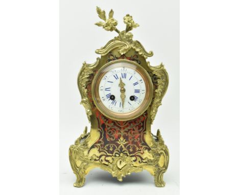 Richard et Cie - an early 20th century French Rococo style boulle work mantle clock. The clock with brass floral finial top, 