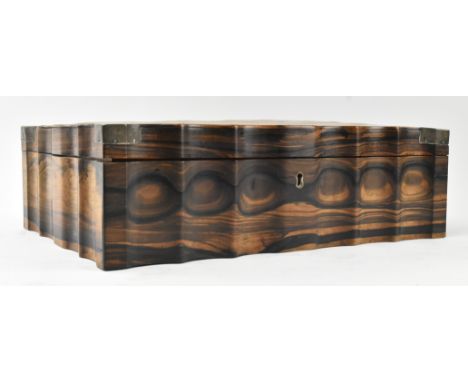 A Ceylonese Sri Lanka 19th century coromandel wood and white metal bound sewing table box. The box having serpentine edges wi