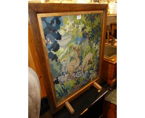 A mid-20th century oak and tapestry inset fire screen, w.55cm 