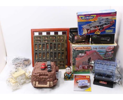 2 trays containing a selection of mixed children's toys including a Sylvanian Families Log Cabin, a Corgi Toys James Bond Lot