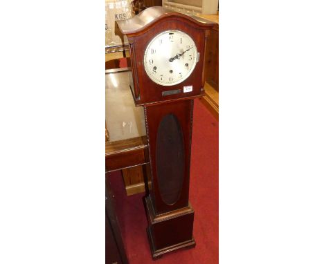 A 1930s mahogany grandmother clock, having striking and chiming movement, glazed panel trunk inset, height 139.5cm