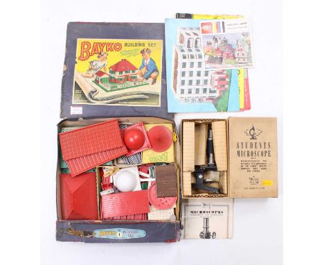 A boxed Bayko building set with contents together with a J &amp; L Randall Students Microscope