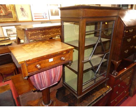 An early Victorian mahogany and birds-eye maple inlaid chessboard topped work table, having single frieze drawer over basket 