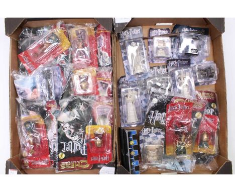 Two trays containing 20+ various Harry Potter chess related miniatures to include Knight, Pawn, Bishop, and others, all as re