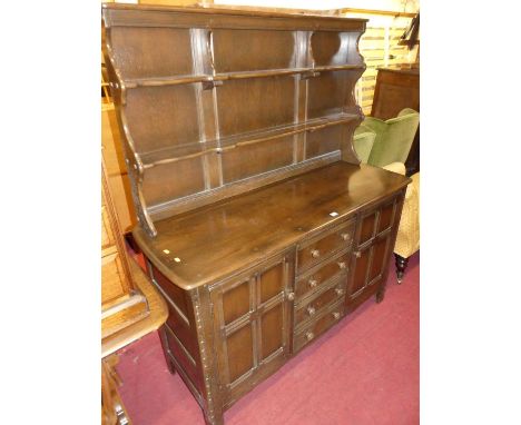 An Ercol dark elm dresser, w.146cm