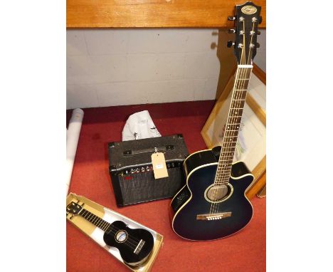 A Stagg acoustic guitar in canvas case, together with a child's Mahalo acoustic guitar, and a Stagg CA.20R reverb amplifier (