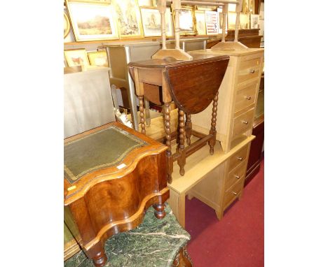 A contemporary light oak single pedestal desk; together with a matching three drawer bedside chest; a 1920s oak bobbin turned