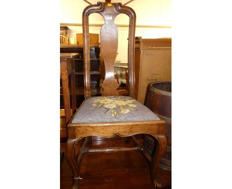 An 18th century provincial walnut single splat back dining chair, having a later floral tapestry needlework drop-in pad seat,