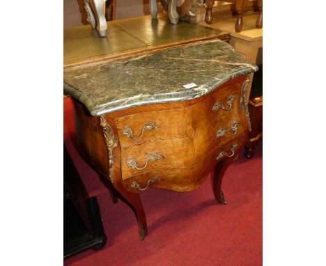 A Louis XV style French figured walnut kingwood and gilt metal mounted three drawer bombe commode, having a green variegated 