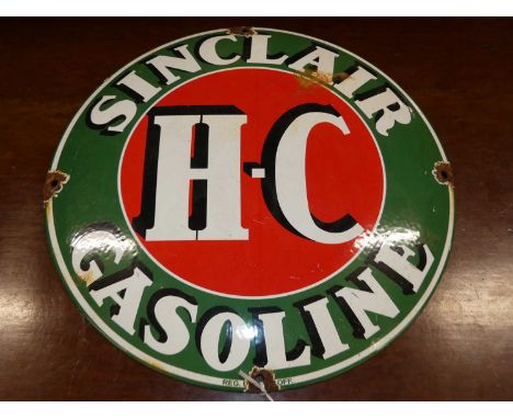 An enamel on metal circular convex advertising sign for Sinclair Gasoline, dia.30cm