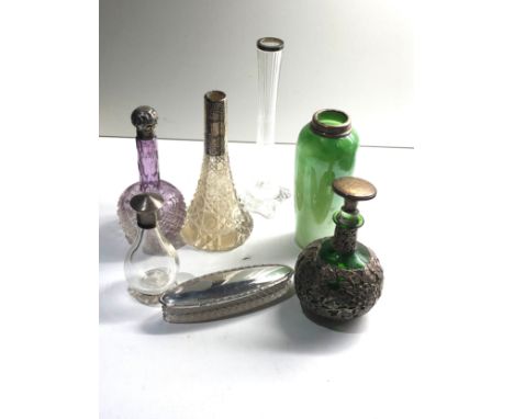 Selection of silver items includes scent bottles trinket bowl silver rimmed vases etc 