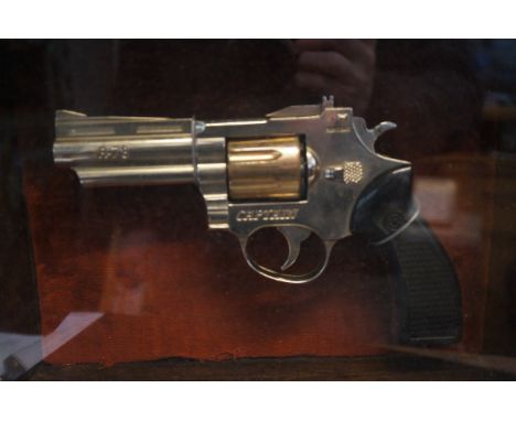 Large cigarette lighter gun in display case 