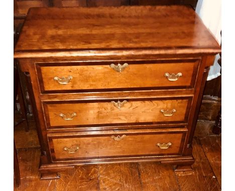 A George III revival mahogany crossbanded chest of drawers, rectangular moulded edge top, above three graduate drawers brass 