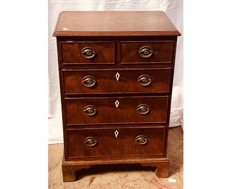A George IV revival mahogany chest of drawers, a moulded edge top, two short and three long gradual drawers with&nbsp;embosse