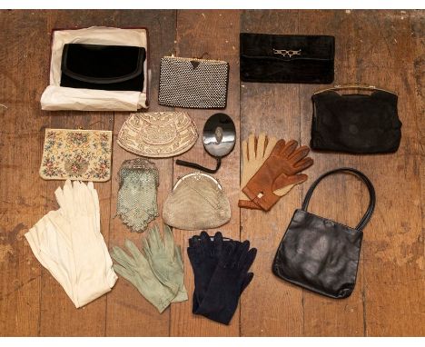 A collection of leather and suede gloves and driving gloves. A box containing a velvet evening bag (1980), a selection of eve