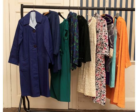 Ten items of 1950s/60s/70s items of clothing to include: A navy raincoat, long jacket, a jade green 1950s dress with a diaman