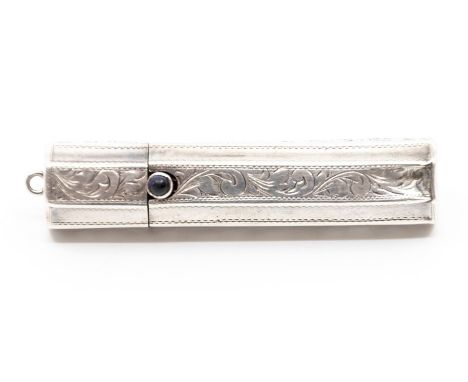 An early 20th Century silver lipstick tube, bright cut engraved, sapphire cabochon button