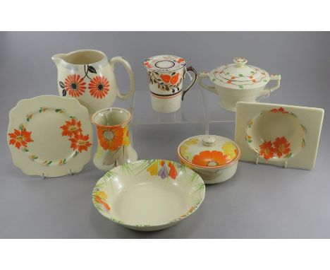 A mixed group of early twentieth century art deco period floral decorated wares, c. 1910-30. Comprising of: a jug, a covered 