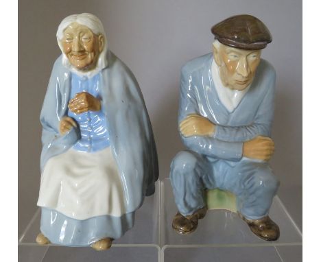 A pair of Irish Porcelain, Wade Portadown Figures modelled by Raymond Piper. They depict Dan Murphy and Mother MacCree, Himse