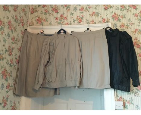 A black leather coat with epaulettes on shoulders, sleeves fall into a cuff with invisible zip, 1970's; a three piece outfit,