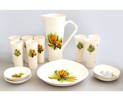A French 1950s pottery water set decorated with orange flowers, marked 'M.B.F.A. Pornic', comprising jug, eight beakers, eigh