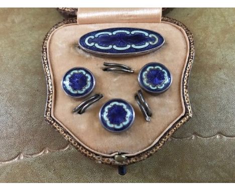 A circa 1920's cased four piece silver and enamel button/brooch set&nbsp;