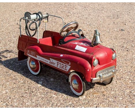 A 1950s children's pedal fire engine, red livery marked 'Fire Dept. Jet Flow Drive No.287', with chrome bell and hose, length