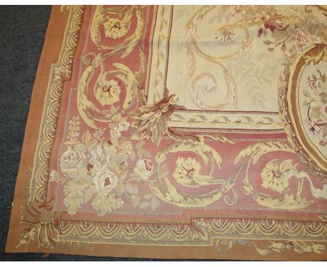 A 20th century, Aubusson style ivory ground tapestry carpet of architectural neoclassical form.366 x 267cm