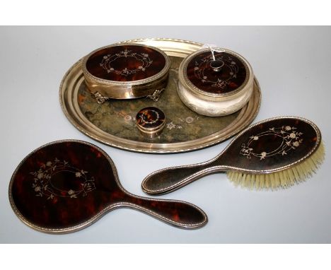 Mappin and Webb, a silver, tortoiseshell set dressing table suite, comprising ring box, mirror, brush, patch and powder boxes