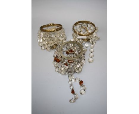 A pair of Edwardian gilt metal prismatic drop ceiling light shades 11.5 cms diameter, together with another with amber and cl