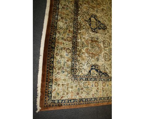 A  Kaoud Carpets "Tabriz" design  Indian  woollen carpet of muted  earth tones fringed at both ends.427 x 306cm