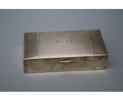 S Ltd., a silver cigarette box with engine turned hinged cover initialled S.B enclosing a cedar lined interior, Birmingham 19