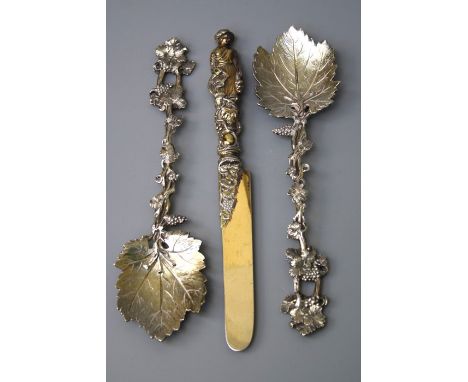 A pair of Victorian cast silver fruit serving spoons, formed as fruiting vines with vine leaf bowls, Sheffield 1881 by Henry 
