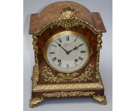 A late 19th or early 20th century gilt brass mounted walnut mantle clock, the eight day movement striking on two gongs stampe