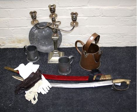 A reproduction Indian cavalry sword with brass lion's mask pommel, a copper water can, two pewter tankards, a 27 cm diameter 